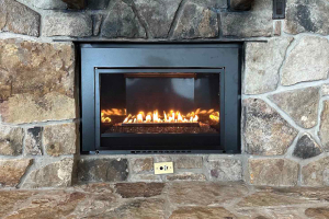 Modern linear gas fireplace with stone surround
